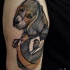 Engraving style colored shoulder tattoo of dog stylized with heart and bird