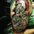 Excellent detailed accurate looking colored ancient Roman warrior tattoo on shoulder zone
