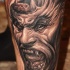 Fantasy illustrative style demonic gorilla tattoo on leg