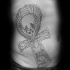 Fantasy style black ink side tattoo of mystical cross stylized with animal