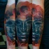 Fantasy style colored arm tattoo of incredible mask with planet