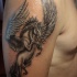 Flying pegasus tattoo on shoulder