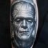 Frankenstein Monster in gray colors tattoo