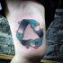 Funny looking colored thigh tattoo of symbol made from skateboards