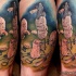 Funny looking colored thigh tattoo of magical peanuts