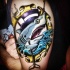 Funny looking illustrative style shoulder tattoo of gentleman shark