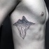 Geometric style black ink side tattoo of mountain