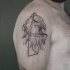 Geometrical style black ink shoulder tattoo of eagle head