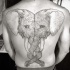 Giant pair of elephant's heads with curled tunks tattoo on whole back in gray ink