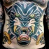Giant whole belly colored furious black panther and sharp crossed daggers tattoo in old school style