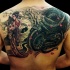 Glamorous colored detailed looking Asian upper back tattoo of dragon and beautiful geisha