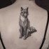 Gorgeous black and white fox tattoo on woman's back in geometrical style