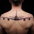 Gorgeous lifelike colored upper back tattoo of big plane