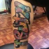 Graffiti style colored leg tattoo of funny lettering