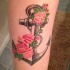 ancora grigia con rose rosa tatuaggio