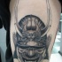 Gray washed style big detailed thigh tattoo of samurai warrior helmet