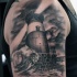 Gray washed style big shoulder tattoo of lighthouse with waves