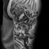 Gray washed style detailed shoulder tattoo of Icarus with with sun