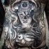 Gray washed style large mystical witch tattoo on belly with human skull