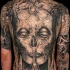 Gray washed style large whole back tattoo of demonic skull with star