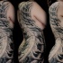 Gray washed style typical side tattoo of alien bones