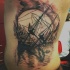 Tatuaggio colorato sulla schiena naufragio della nave a vela & il tramonto