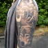 Tatuaggio pittoresco sul braccio il lupo & il paesaggio