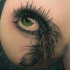 Tatuaggio realistico l'occhio verde