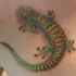 geco verde rosso tatuaggio sulla schiena
