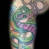 serpente verde e forbici tatuaggio