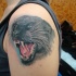 Tatuaggio carino sul deltoide la pantera feroce