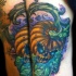 Halloween style multicolored demonic pumpkin tattoo on elbow