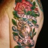Hand with red flower memorial shoulder tattoo with lettering Mom Dad on banner