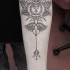 Hinduism style black ink arm tattoo of cool ornament