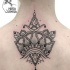 Hinduism style black ink back tattoo of beautiful ornaments