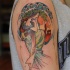Homemade illustrative style colored shoulder tattoo of woman