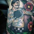 Tatuaje  de boxeador con flores de colores