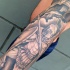 Homemade simple black and white sleeve tattoo of ancient Greece warriors
