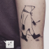Homemade style black ink arm tattoo of big bear