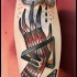 Homemade style colored arm tattoo of mystical hand with cloud and symbols