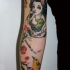 Homemade style colored arm tattoo of little girl with flowers and little bird