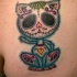 Homemade style colored scapular tattoo of Mexican like cat with ornaments