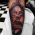 Tatuaje  de vampiro sanguinario feo en el antebrazo