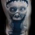 Horror style colored side tattoo of creepy monster face