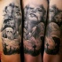 Horror style creepy looking arm tattoo of woman with mask and cemetery monsters