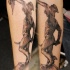 Horror style creepy looking forearm tattoo of antic warrior with Medusa head