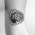 Human brain in spiral vortex tattoo