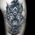 Illustrative style black and white tattoo of large wolf with crow