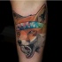 Illustrative style colored arm tattoo of fox with symbol