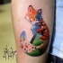 Illustrative style colored arm tattoo of fox stylized with night sky and leaves